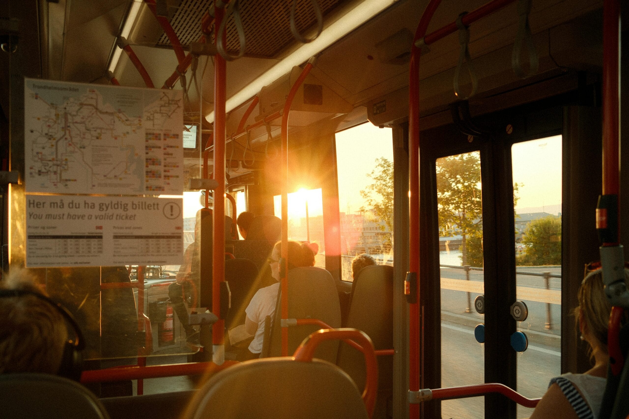 Group unloading skis from charter bus ski trips Northeast at Whiteface base lodge, fresh powder waiting.
