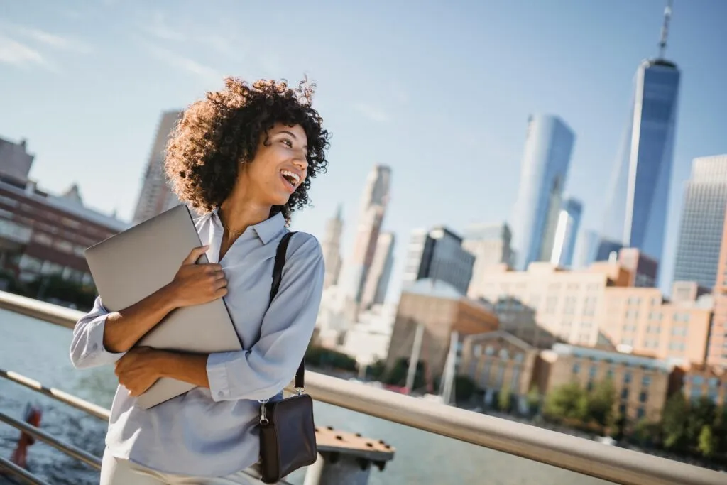 Passenger completing bus passenger survey NYC on phone after ZoloBus ride in New York City