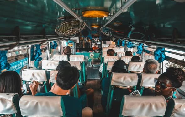 Passengers enjoying eco-friendly charter bus NYC with zero-emission electric coach by ZoloBus Passengers enjoying eco-friendly charter bus NYC with zero-emission electric coach by ZoloBus