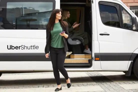 White conference shuttle NYC bus parked ready for corporate event White conference shuttle NYC bus parked ready for corporate event